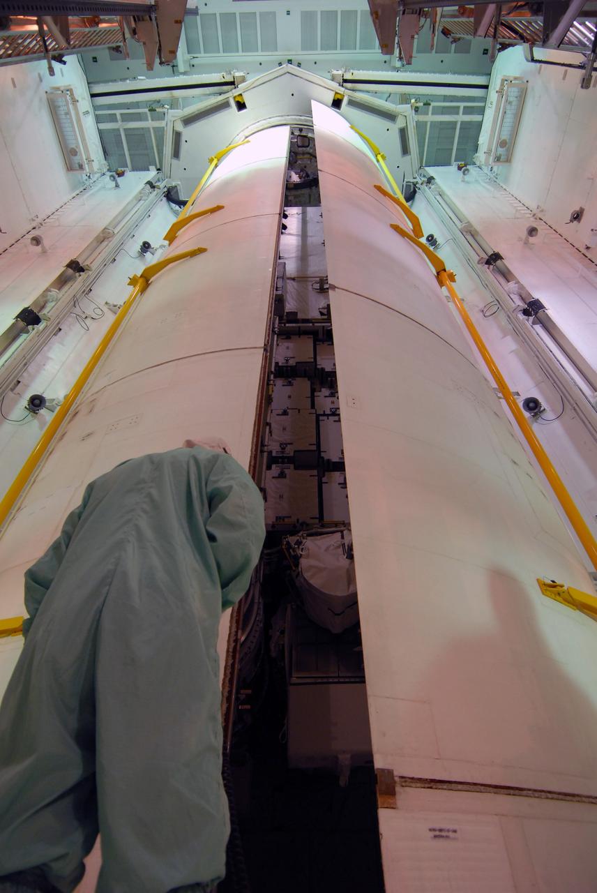 CAPE CANAVERAL, Fla. –   On Launch Pad 39A at NASA's Kennedy Space Center in Florida, the second of space shuttle Discovery's payload bay doors is closing. The cargo inside consists of the integrated truss structure S6 and solar arrays for the STS-119 mission to the International Space Station. During Discovery's 14-day mission, the shuttle's seven astronauts will install the S6 truss to the starboard side of the space station, completing the station's truss, or backbone. Launch of Discovery on the STS-119 mission is targeted for Feb. 12.  Photo credit: NASA/Dimitri Gerondidakis