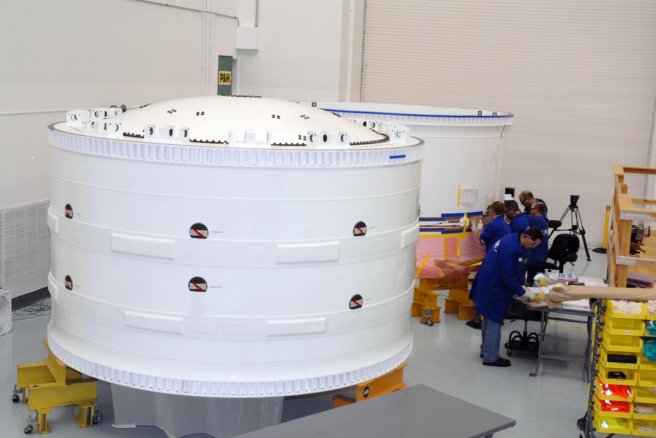 CAPE CANAVERAL, Fla. –   At Astrotech in Titusville, Fla., the forward fifth segment simulator of the Ares I-X is being prepared for cork application. Ares I-X is the test vehicle for the Ares I, which is part of the Constellation Program to return men to the moon and beyond.  Ares I is the essential core of a safe, reliable, cost-effective space transportation system that eventually will carry crewed missions back to the moon, on to Mars and out into the solar system. Ares I may also use its 25-ton payload capacity to deliver resources and supplies to the International Space Station, or to "park" payloads in orbit for retrieval by other spacecraft bound for the moon or other destinations. The Ares I-X is targeted for launch in July 2009. Photo credit: NASA/Tim Jacobs