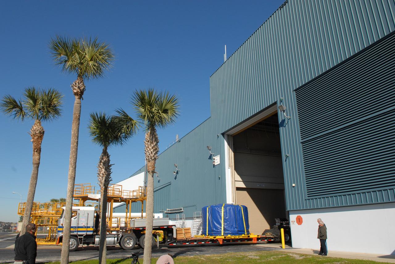 CAPE CANAVERAL, Fla. –    Wrapped and strapped, the Ares I-X forward skirt arrives at the Assembly and Refurbishment Facility, or ARF, at NASA's Kennedy Space Center in Florida. The forward skirt is the initial piece of first-stage hardware in preparation for the July 2009 test flight of the agency's next-generation spacecraft and launch vehicle system. Built entirely of armored steel, the 14,000-pound segment is seven feet tall and 12-1/4 feet wide.  United Space Alliance, under a subcontract to ATK,  will complete the integration and assembly of the forward skirt components in the ARF. It will then be moved to the Vehicle Assembly Building high bay 3 for stacking operations.  Photo credit: NASA/Tim Jacobs