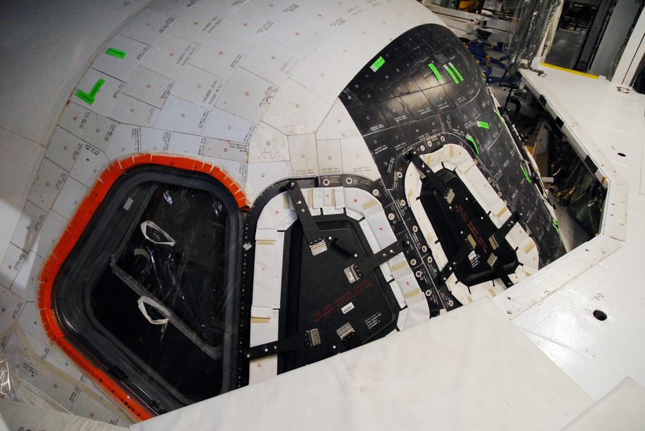 CAPE CANAVERAL, Fla. –  In Orbiter Processing Facility bay 2 at NASA's Kennedy Space Center in Florida, window six on space shuttle Endeavour is being replaced. Endeavour is the designated launch vehicle for the STS-127 mission.  The Japanese Experiment Module's Experiment Logistics Module-Exposed Section, or ELM-ES, is part of the payload on the mission, targeted for launch on May 15.  Photo credit: NASA/Tim Jacobs