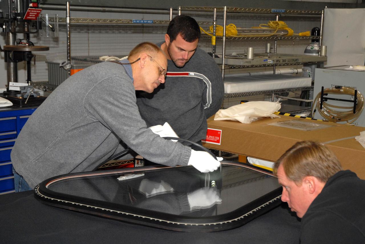 CAPE CANAVERAL, Fla. –  In Orbiter Processing Facility bay 2 at NASA's Kennedy Space Center in Florida, workers prepare a new window to replace window six on space shuttle Endeavour.  Endeavour is the designated launch vehicle for the STS-127 mission.  The Japanese Experiment Module's Experiment Logistics Module-Exposed Section, or ELM-ES, is part of the payload on the mission, targeted for launch on May 15.  Photo credit: NASA/Tim Jacobs