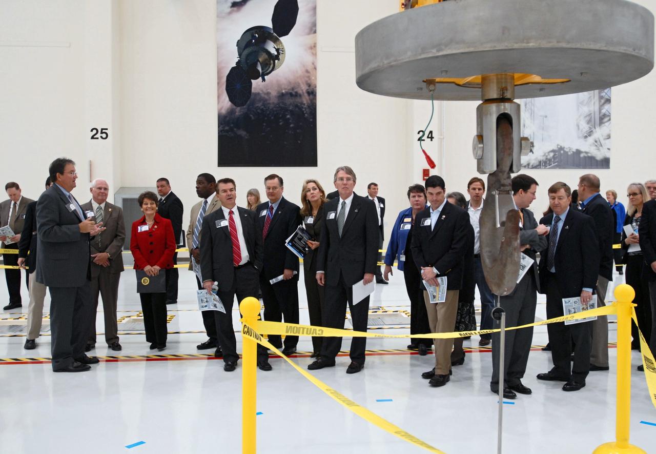 CAPE CANAVERAL, Fla. – Representatives from NASA, Lockheed Martin, Space Florida and the state of Florida participate in a ceremony at NASA's Kennedy Space Center in Florida to mark the completion of renovations on the historic Operations and Checkout Building high bay for use by the Constellation Program. At left, Richard Harris, with Lockheed Martin, describes activities that will take place in the building. Originally built to process space vehicles in the Apollo era, the building will serve as the final assembly facility for the Orion crew exploration vehicle. Orion, America's future human spaceflight vehicle, will be capable of transporting four crew members to the moon and later will support crew transfers to Mars. The Orion spacecraft also will be used to transport crew members to the International Space Station after space shuttles are retired in 2010. The first operational launch of Orion atop an Ares I rocket is planned for 2015. Photo credit: NASA/Dimitri Gerondidakis