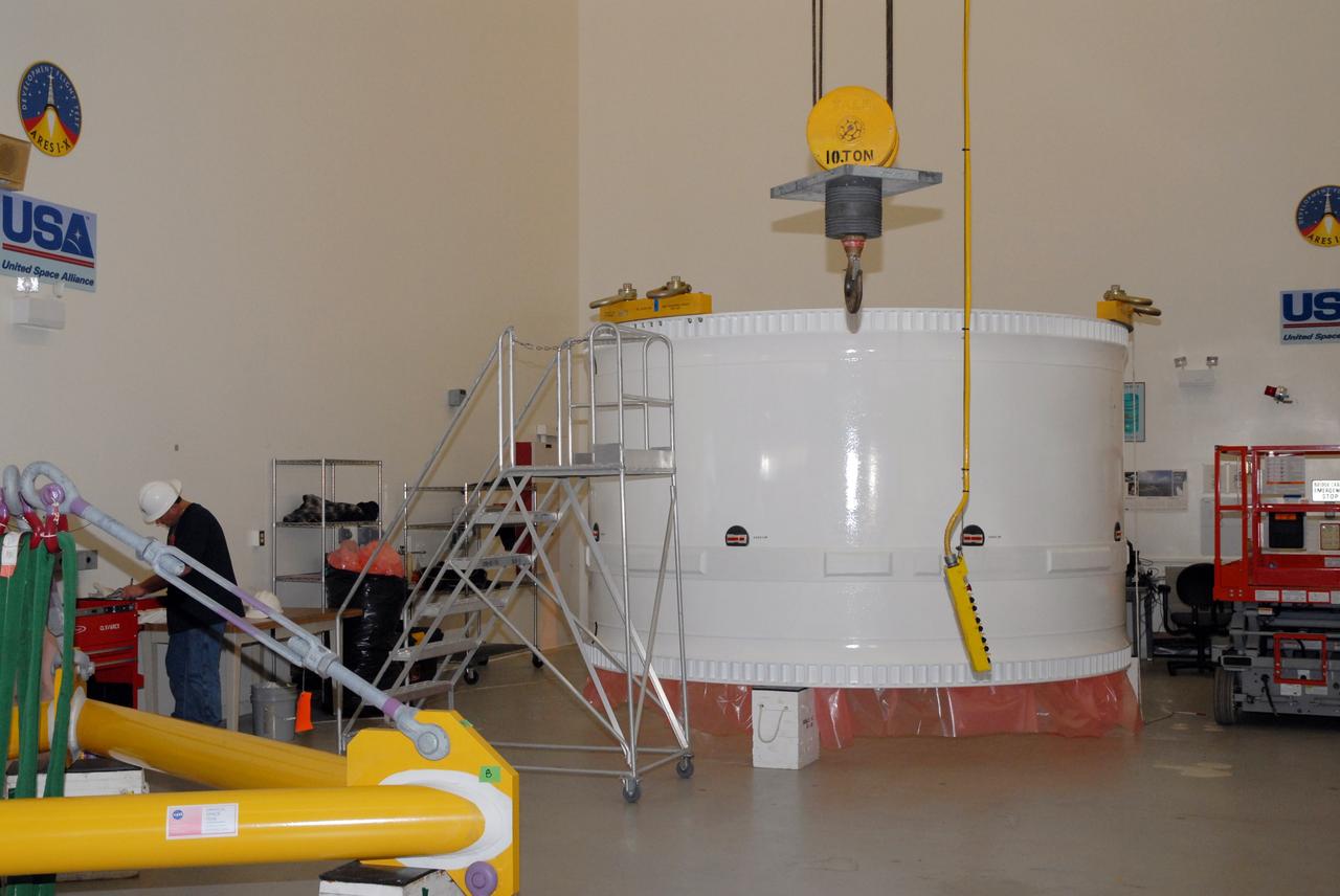 CAPE CANAVERAL, Fla. –  In the Vehicle Assembly Building at NASA's Kennedy Space Center in Florida, the fifth segment simulator of the Ares I-X is on a work stand.  Ares I-X is the test vehicle for the Ares I, which is part of the Constellation Program to return men to the moon and beyond.  Ares I is the essential core of a safe, reliable, cost-effective space transportation system that eventually will carry crewed missions back to the moon, on to Mars and out into the solar system. Ares I-X is targeted for launch in July 2009.