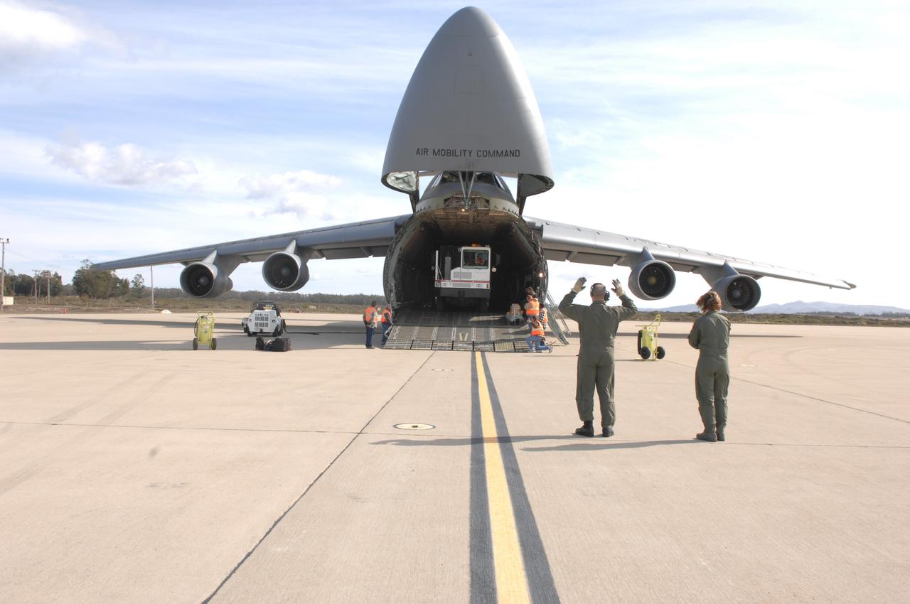VANDENBERG AIR FORCE BASE, Calif.  –  The latest polar-orbiting operational environmental weather satellite developed by NASA for the National Oceanic and Atmospheric Administration, called NOAA-N Prime, is being offloaded from the C-5A military cargo aircraft at Vandenberg Air Force Base, Calif., in preparation for a Feb. 4 launch. NOAA-N Prime, built by Lockheed Martin, is similar to NOAA-N launched on May 20, 2005.