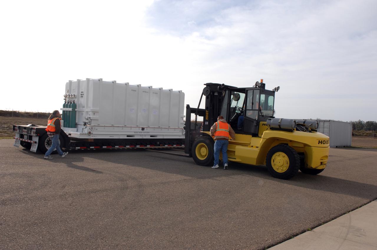 VANDENBERG AIR FORCE BASE, Calif.  –  The latest polar-orbiting operational environmental weather satellite developed by NASA for the National Oceanic and Atmospheric Administration, called NOAA-N Prime, is offloaded from the trailer at Vandenberg Air Force Base, Calif.  The spacecraft will be moved into a NASA payload processing facility and prepared for a Feb. 4 launch. NOAA-N Prime, built by Lockheed Martin, is similar to NOAA-N launched on May 20, 2005.