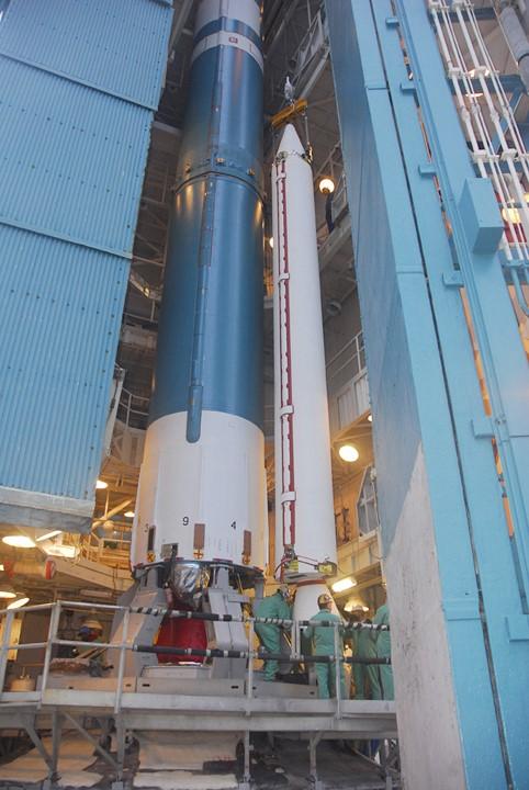 VANDENBERG AIR FORCE BASE, Calif. –    On Space Launch Complex 2 at Vandenberg Air Force Base in California, a solid rocket booster is lifted alongside the Delta II rocket for installation.  The booster is being prepared for the launch of the NOAA-N Prime satellite. NOAA-N Prime is the latest polar-orbiting operational environmental weather satellite developed by NASA for the National Oceanic and Atmospheric Administration.  It is built by Lockheed Martin and similar to NOAA-N launched on May 20, 2005. Launch of NOAA-N Prime is scheduled for Feb. 4.   Photo credit: NASA/Joe Davila, VAFB