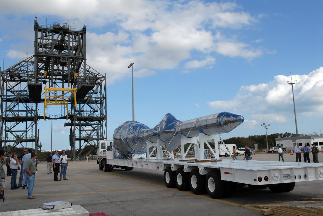 CAPE CANAVERAL, Fla. – At the Shuttle Landing Facility at NASA's Kennedy Space Center in Florida, hardware that will be used in the launch of the Ares I-X rocket is being offloaded from the C-5 aircraft. The hardware consists of a precisely machined, full-scale simulator crew module and launch abort system to form the tip of NASA's Ares I-X rocket. The launch of the 321-foot-tall, full-scale Ares I-X, targeted for July 2009, will be the first in a series of unpiloted rocket launches from Kennedy. When fully developed, the 16-foot diameter crew module will furnish living space and reentry protection for the astronauts, while their launch abort system will provide safe evacuation if a launch vehicle failure occurs.    Photo credit: NASA/Jack Pfaller