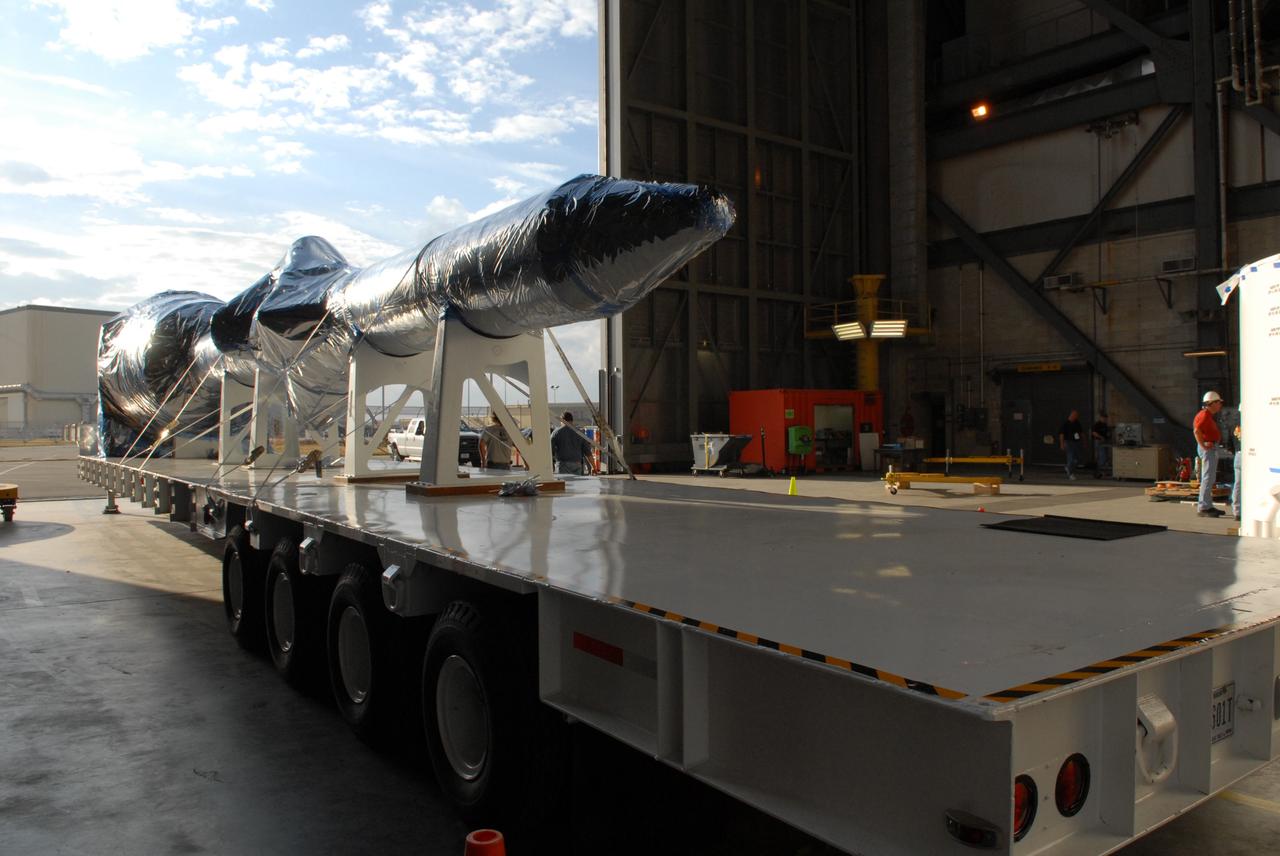 CAPE CANAVERAL, Fla. –  The launch abort system for the Ares I-X rocket is moved inside the Vehicle Assembly Building's high bay 4 at NASA's Kennedy Space Center in Florida.  The launch abort system joins the precisely machined, full-scale simulator crew module, which, together, will form the tip of the Ares I-X.  Ares I-X is the test flight for the Ares I.   The I-X flight will provide NASA an early opportunity to test and prove hardware, facilities and ground operations associated with Ares I. The launch of the 321-foot-tall, full-scale Ares I-X, targeted for July 2009, will be the first in a series of unpiloted rocket launches from Kennedy. When fully developed, the 16-foot diameter crew module will furnish living space and reentry protection for the astronauts, while their launch abort system will provide safe evacuation if a launch vehicle failure occurs.   Photo credit: NASA/Jack Pfaller