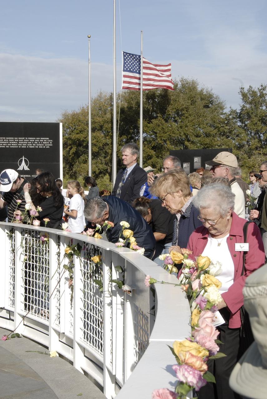 CAPE CANAVERAL, Fla. –  At the Kennedy Space Center Visitor Complex, guests pay tribute to the crews of Apollo 1 and space shuttles Challenger and Columbia, as well as other NASA colleagues who lost their lives while furthering the cause of exploration and discovery, during NASA's Day of Remembrance observance Jan. 29. The public was invited to a wreath-laying at the Space Mirror Memorial at the visitor complex.  Center Director and former astronaut Bob Cabana took part in the ceremony.   Photo credit: NASA/Kim Shiflett