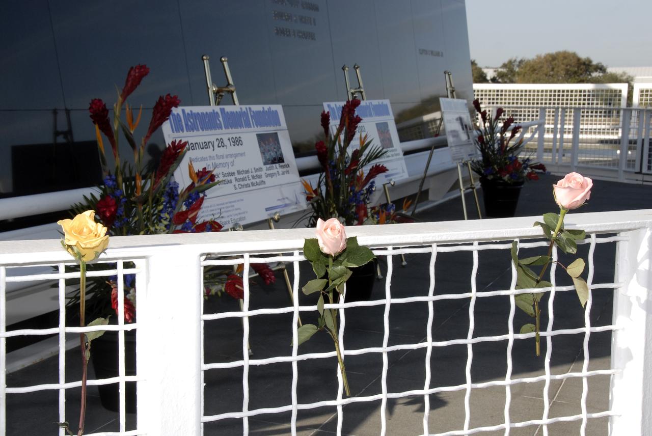 CAPE CANAVERAL, Fla. –  In front of the Space Mirror Memorial at the Kennedy Space Center Visitor Complex, floral arrangements and exhibits pay tribute to the crews of Apollo 1 and space shuttles Challenger and Columbia, as well as other NASA colleagues, who lost their lives while furthering the cause of exploration and discovery.  Center Director Bob Cabana presided over the wreath-laying ceremony, which was open to the public.   Photo credit: NASA/Kim Shiflett