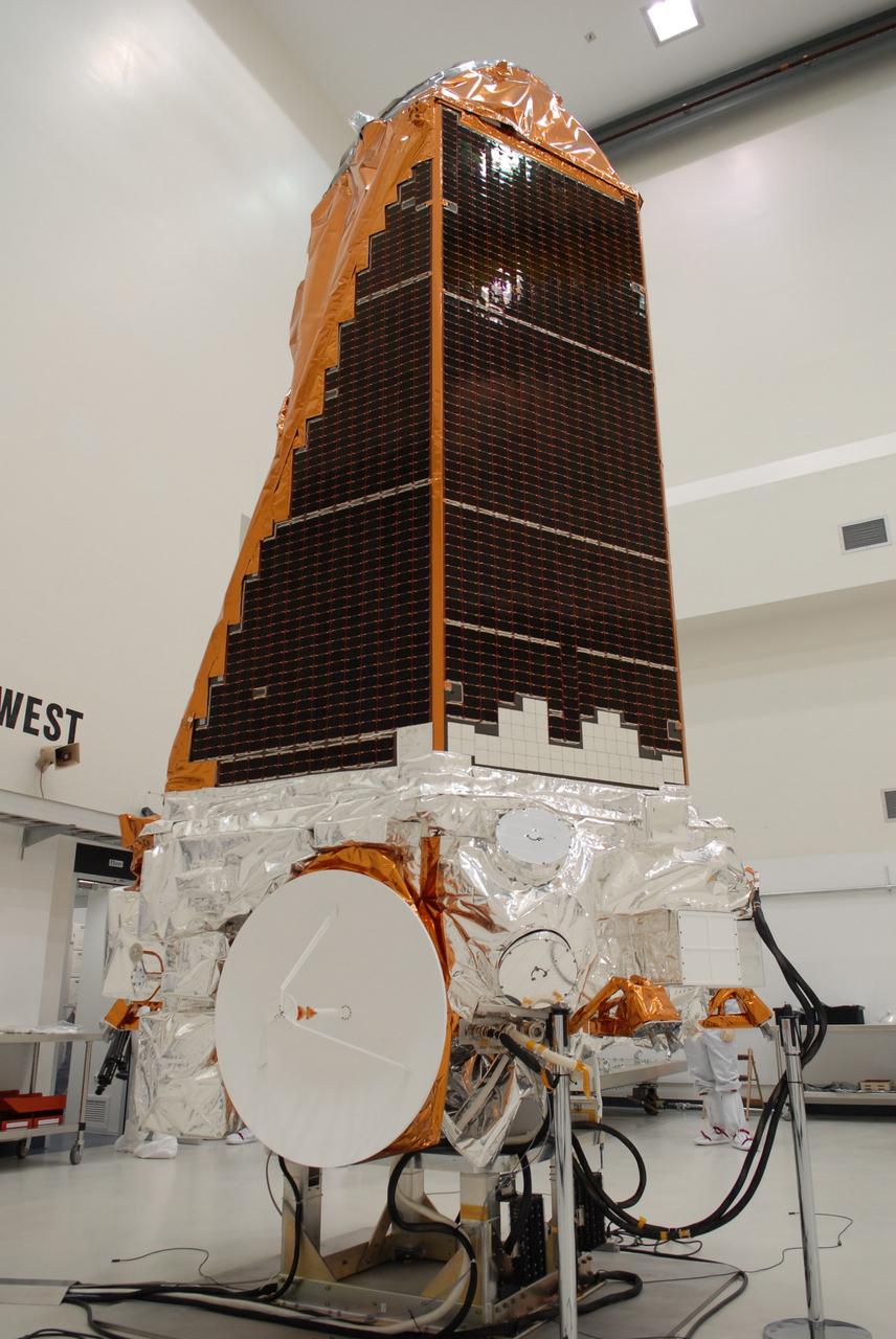CAPE CANAVERAL, Fla. – NASA's Kepler spacecraft, that will be launched in March aboard a United Launch Alliance Delta II rocket, is ready for the media opportunity Jan. 30. Visible are the solar arrays on top and the high-gain antenna at lower left. The event, being held at the Astrotech Space Operations facility in Titusville, Fla., will provide media representatives an opportunity to photograph the space telescope and to interview project officials from NASA and Ball Aerospace, builder of the spacecraft. Kepler is designed to survey more that 100,000 stars in our galaxy to determine the number of sun-like stars that have Earth-size and larger planets, including those that lie in a star's "habitable zone," a region where liquid water, and perhaps life, could exist. If these Earth-size worlds do exist around stars like our sun, Kepler is expected to be the first to find them and the first to measure how common they are. The liftoff of Kepler aboard a Delta II rocket is currently planned for 10:48 p.m. EST March 5 from Space Launch Complex 17 on Cape Canaveral Air Force Station. Photo credit: NASA/Troy Cryder