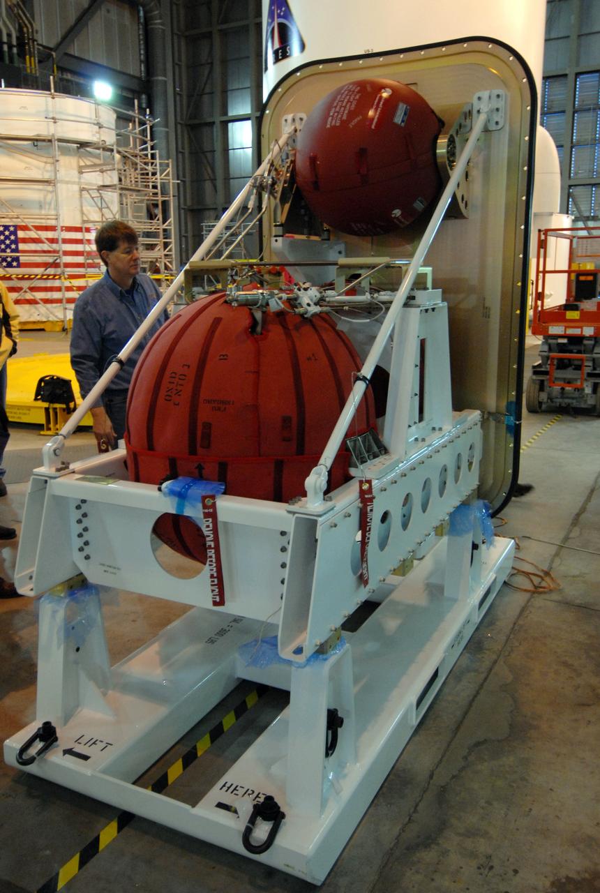 CAPE CANAVERAL, Fla. – The Ares I-X roll control system module is revealed after removal of the plastic wrap. The module is in the Vehicle Assembly Building at NASA's Kennedy Space Center in Florida. The system is designed to perform a 90-degree roll after the rocket clears the launch tower, preventing a roll during flight and maintaining the orientation of the rocket until separation of the upper and first stages. Part of the upper stage simulator, the system module is composed to two modules and four thrusters. The system module will return to earth and splash down; it will not be recovered. Ares I-X is the test vehicle for the Ares I, which is part of the Constellation Program to return men to the moon and beyond. Ares I is the essential core of a safe, reliable, cost-effective space transportation system that eventually will carry crewed missions back to the moon, on to Mars and out into the solar system. Ares I-X is targeted for launch in July 2009. Photo credit: NASA/Jack Pfaller