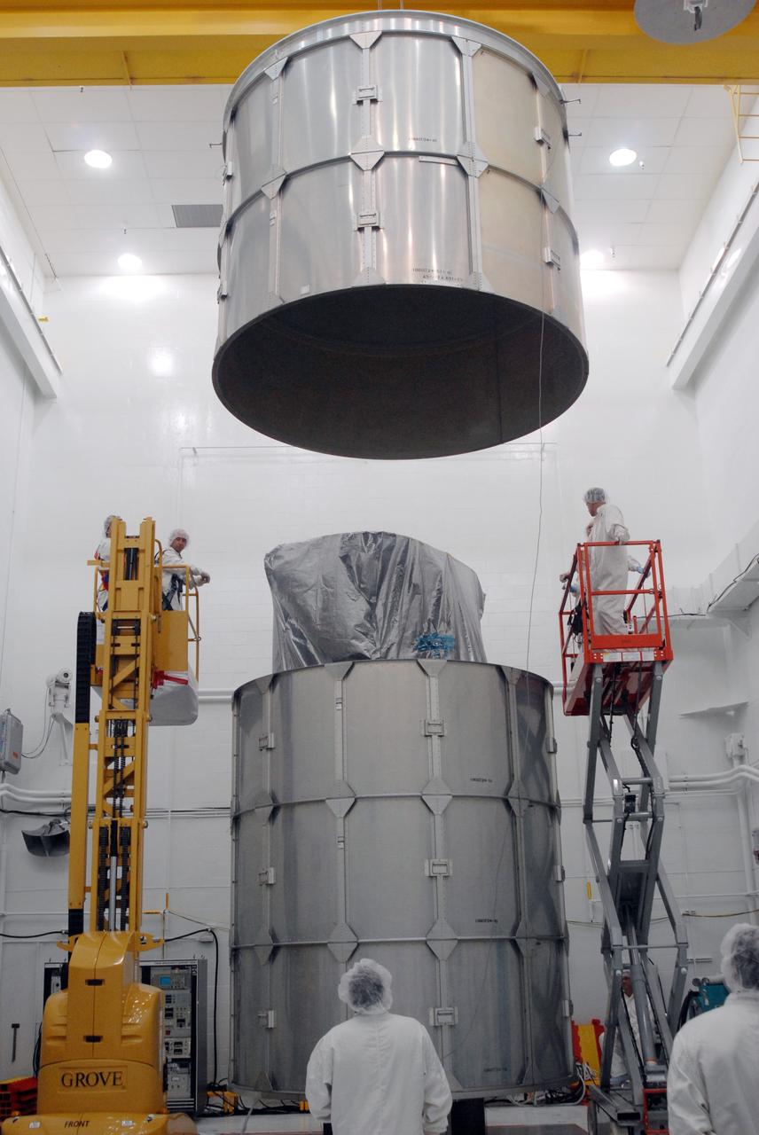 VANDENBERG AIR FORCE BASE, Calif. --    In Bldg. 1610 at Vandenberg Air Force Base in California, a transportation canister is being placed around the NOAA-N Prime spacecraft. NOAA-N Prime is the latest polar-orbiting operational environmental weather satellite developed by NASA for the National Oceanic and Atmospheric Administration.  The satellite is scheduled to launch Feb. 4 aboard a Delta II rocket from Vandenberg Air Force Base. Photo credit: NASA/ Daniel Liberotti, VAFB