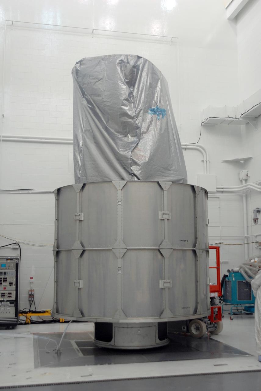 VANDENBERG AIR FORCE BASE, Calif. --  In Bldg. 1610 at Vandenberg Air Force Base in California, two rows of the transportation canister are installed around the NOAA-N Prime spacecraft.  NOAA-N Prime is the latest polar-orbiting operational environmental weather satellite developed by NASA for the National Oceanic and Atmospheric Administration.  The satellite is scheduled to launch Feb. 4 aboard a Delta II rocket from Vandenberg Air Force Base. Photo credit: NASA/ Daniel Liberotti, VAFB