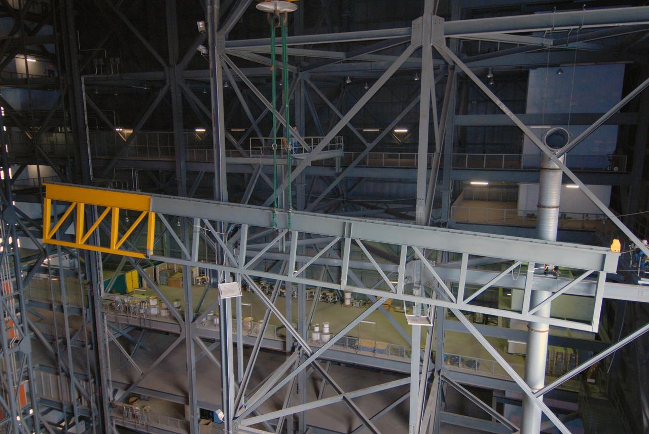 CAPE CANAVERAL, Fla. – In the Vehicle Assembly Building at NASA's Kennedy Space Center in Florida, an upper rail is being removed in high bay 3 as part of the modifications for the Constellation Program's Ares vehicles. The Ares I and Ares V rockets will be 325 feet and 360 feet tall, respectively, considerably taller than the space shuttle atop its mobile launcher platform.   Photo credit: NASA/Jack Pfaller