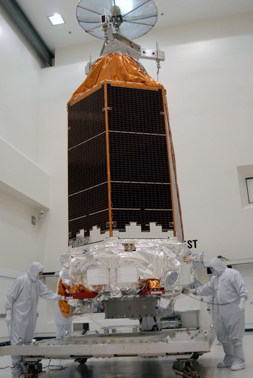 CAPE CANAVERAL, Fla. – At the Astrotech payload processing facility, an overhead crane carries NASA's Kepler spacecraft toward a mobile stand to be covered and moved to the Hazardous Processing Facility for fueling. Kepler is designed to survey more than 100,000 stars in our galaxy to determine the number of sun-like stars that have Earth-size and larger planets, including those that lie in a star's "habitable zone," a region where liquid water, and perhaps life, could exist. If these Earth-size worlds do exist around stars like our sun, Kepler is expected to be the first to find them and the first to measure how common they are. The liftoff of Kepler aboard a Delta II rocket is currently planned for 10:48 p.m. EST March 5 from Space Launch Complex 17 on Cape Canaveral Air Force Station. Photo credit: NASA/Jack Pfaller