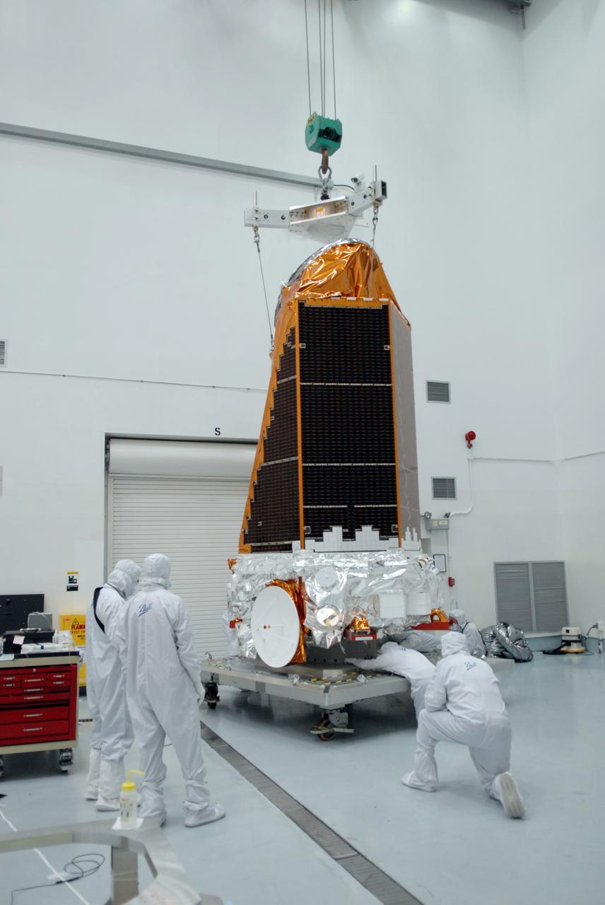 CAPE CANAVERAL, Fla. – Inside Inside the Hazardous Processing Facility at Astrotech in Titusville, Fla., NASA's Kepler spacecraft is being moved to another stand for fueling. Kepler is designed to survey more than 100,000 stars in our galaxy to determine the number of sun-like stars that have Earth-size and larger planets, including those that lie in a star's "habitable zone," a region where liquid water, and perhaps life, could exist. If these Earth-size worlds do exist around stars like our sun, Kepler is expected to be the first to find them and the first to measure how common they are. The liftoff of Kepler aboard a Delta II rocket is currently planned for 10:48 p.m. EST March 5 from Space Launch Complex 17 on Cape Canaveral Air Force Station. Photo credit: NASA/Tim Jacobs