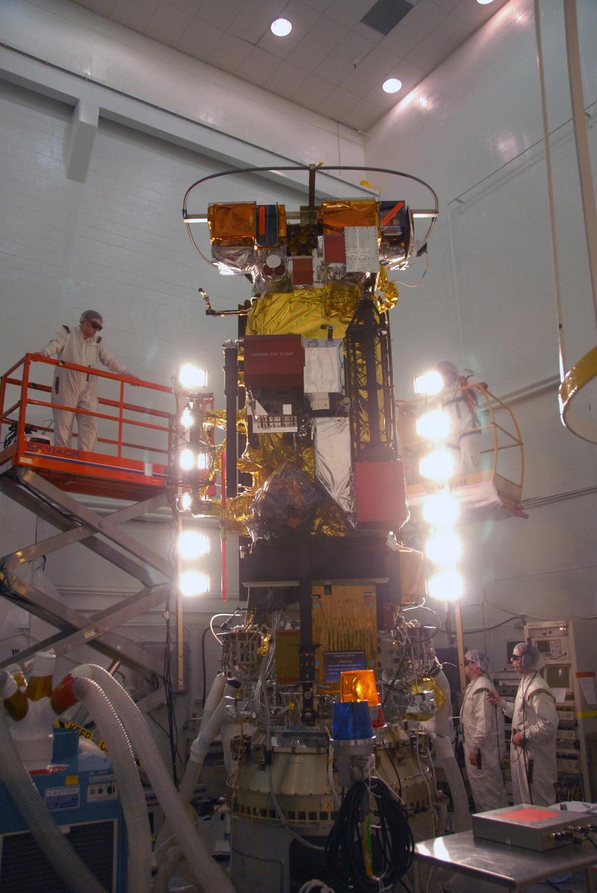 VANDENBERG AIR FORCE BASE, Calif. -- In the NASA payload processing facility at Vandenberg Air Force Base in California, workers conduct solar array illumination on the NOAA-N Prime satellite. NOAA-N Prime is the latest polar-orbiting operational environmental weather satellite developed by NASA for the National Oceanic and Atmospheric Administration. The satellite is scheduled to launch Feb. 4 aboard a Delta II rocket from Vandenberg Air Force Base. Photo credit: NASA/Robert Hargreaves Jr., VAFB