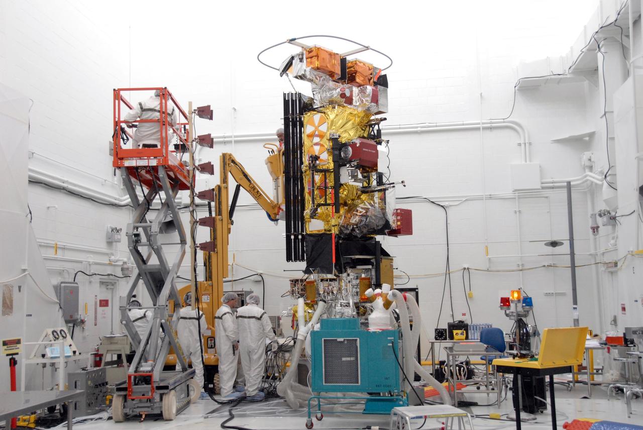 VANDENBERG AIR FORCE BASE, Calif. -- In the NASA payload processing facility at Vandenberg Air Force Base in California, workers complete the solar array illumination on the NOAA-N Prime satellite. NOAA-N Prime is the latest polar-orbiting operational environmental weather satellite developed by NASA for the National Oceanic and Atmospheric Administration. The satellite is scheduled to launch Feb. 4 aboard a Delta II rocket from Vandenberg Air Force Base. Photo credit: NASA/Robert Hargreaves Jr., VAFB