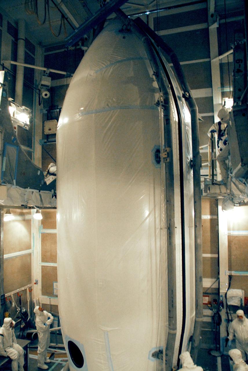 VANDENBERG AIR FORCE BASE, Calif. -- The two halves of the fairing are closed around the NOAA-N Prime spacecraft in the launch service tower on Space Launch Complex 2 at Vandenberg Air Force Base in California. The fairing is a molded structure that fits flush with the outside surface of the rocket and forms an aerodynamically smooth nose cone, protecting the spacecraft during launch and ascent. NOAA-N Prime is the latest polar-orbiting operational environmental weather satellite developed by NASA for the National Oceanic and Atmospheric Administration. The satellite is scheduled to launch Feb. 4 aboard the Delta II from Vandenberg Air Force Base. Photo credit: NASA/Mark Mackley, VAFB