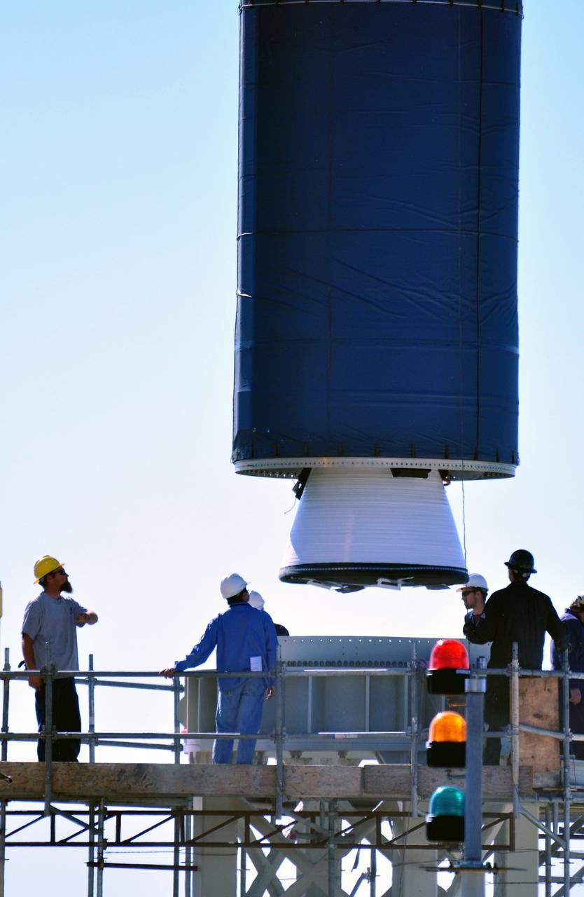 VANDENBERG AIR FORCE BASE, Calif. --  At complex 576E at Vandenberg Air Force Base in California, a crane lifts Stage 0 of the Taurus XL launch vehicle for the Orbiting Carbon Observatory from its transporter.  The OCO is a new Earth-orbiting mission sponsored by NASA's Earth System Science Pathfinder Program. It is scheduled to launch Feb. 23. Photo credit: NASA/Randy Beaudoin, VAFB