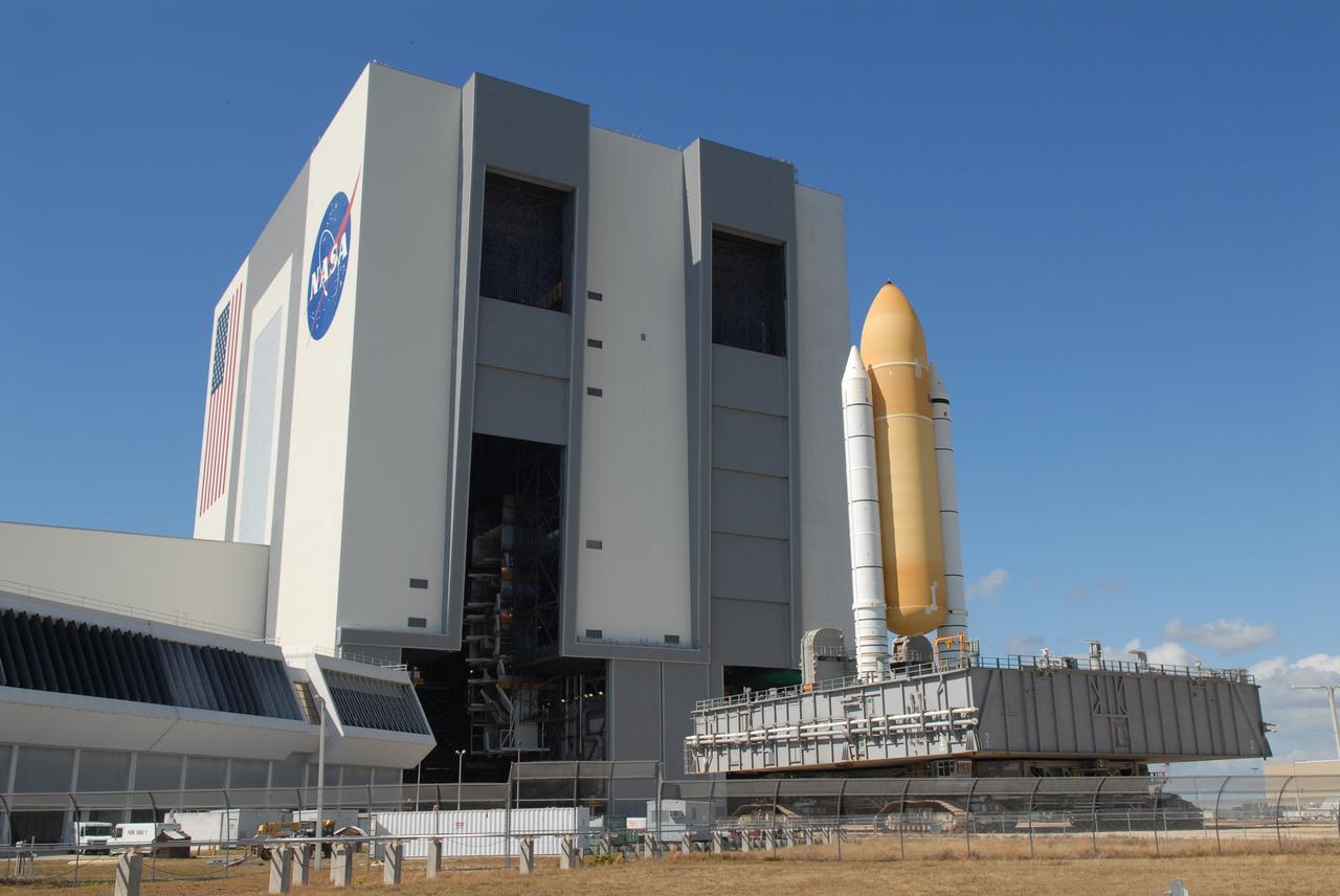 CAPE CANAVERAL, Fla. –  Space shuttle Atlantis' external fuel tank-solid rocket booster stack, atop a mobile launcher platform, rolls away from the Vehicle Assembly Building at NASA's Kennedy Space Center.   It is being moved from high bay 1 to high bay 3 to make room for the ET-SRB stack for space shuttle Endeavour. Atlantis is targeted for launch on the STS-125 mission on May 12 to service NASA's Hubble Space Telescope.  Endeavour will fly on the STS-127 mission to the International Space Station and bring the final segments for Japan's Kibo laboratory. Photo credit: NASA/Dimitri Gerondidakis