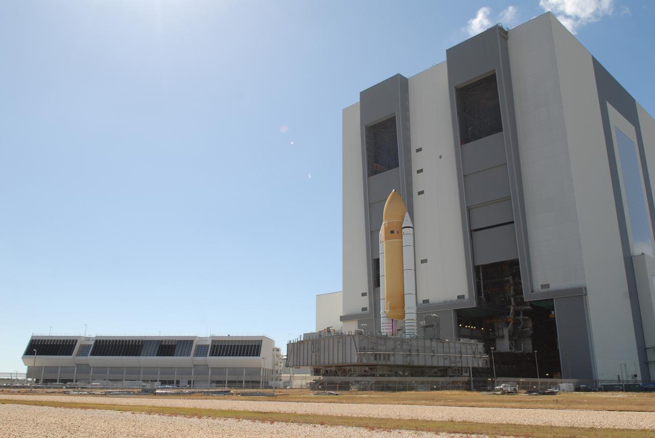 CAPE CANAVERAL, Fla. –  After moving out of high bay 1 in the Vehicle Assembly Building at NASA's Kennedy Space Center, space shuttle Atlantis' external fuel tank-solid rocket booster stack, atop a mobile launcher platform, rolls toward high bay 3.  The move makes room in high bay 1 for the ET-SRB stack for space shuttle Endeavour. Atlantis is targeted for launch on the STS-125 mission on May 12 to service NASA's Hubble Space Telescope.  Endeavour will fly on the STS-127 mission to the International Space Station and bring the final segments for Japan's Kibo laboratory. Photo credit: NASA/Dimitri Gerondidakis