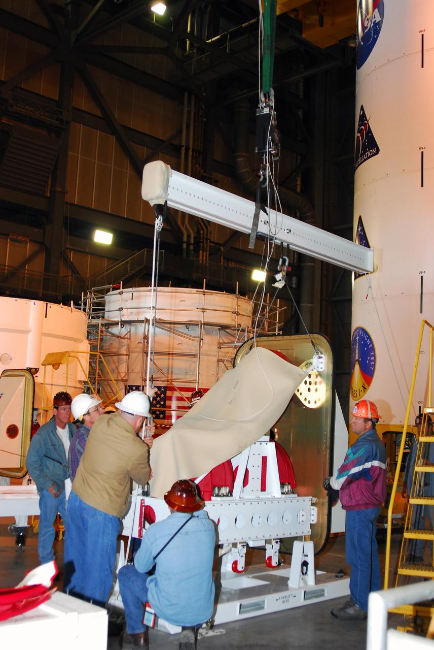 CAPE CANAVERAL, Fla. –  The Ares I-X roll control system module, comprising two modules and four thrusters, is being prepared for a fit check on the Ares I-X rocket upper stage simulator.  The hardware is in high bay 4 of the Vehicle Assembly Building at NASA's Kennedy Space Center. The system is designed to perform a 90-degree roll after the rocket clears the launch tower, preventing a roll during flight and maintaining the orientation of the rocket until separation of the upper and first stages. The system module will return to earth and splash down; it will not be recovered.  Ares I-X is the test vehicle for the Ares I, which is part of the Constellation Program to return men to the moon and beyond.  Ares I-X is targeted for launch in summer of 2009.  Photo credit: NASA/Tim Jacobs