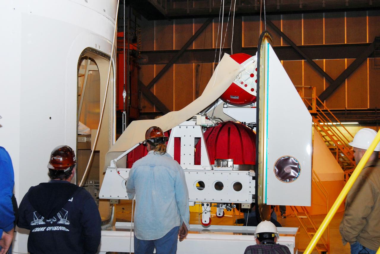 CAPE CANAVERAL, Fla. –  The Ares I-X roll control system module, comprising two modules and four thrusters, is being prepared for a fit check on the Ares I-X rocket upper stage simulator.  The hardware is in high bay 4 of the Vehicle Assembly Building at NASA's Kennedy Space Center. The system is designed to perform a 90-degree roll after the rocket clears the launch tower, preventing a roll during flight and maintaining the orientation of the rocket until separation of the upper and first stages. The system module will return to earth and splash down; it will not be recovered.  Ares I-X is the test vehicle for the Ares I, which is part of the Constellation Program to return men to the moon and beyond.  Ares I-X is targeted for launch in summer of 2009.  Photo credit: NASA/Tim Jacobs