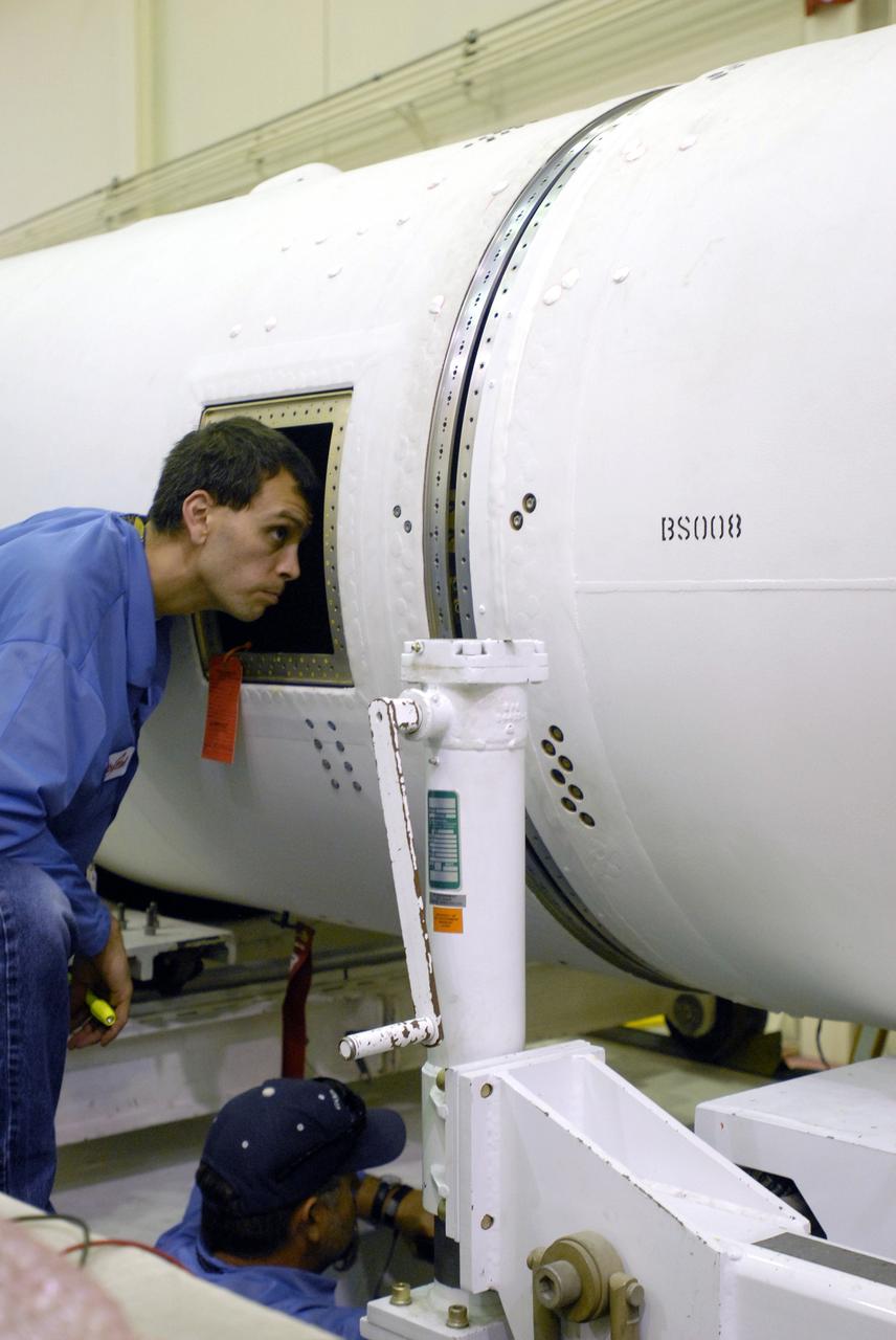 VANDENBERG AIR FORCE BASE, Calif. --  Space Launch Complex 576-E, Vandenberg Air Force Base in California, a worker checks the integration of the Taurus XL Stages 1 and 2.  The Taurus is the launch vehicle for NASA's Orbiting Carbon Observatory, called OCO, a new Earth-orbiting mission sponsored by NASA's Earth System Science Pathfinder Program. The observatory is targeted to launch Feb. 23 from Space Launch Complex 576-E at Vandenberg. Photo credit: NASA/VAFB