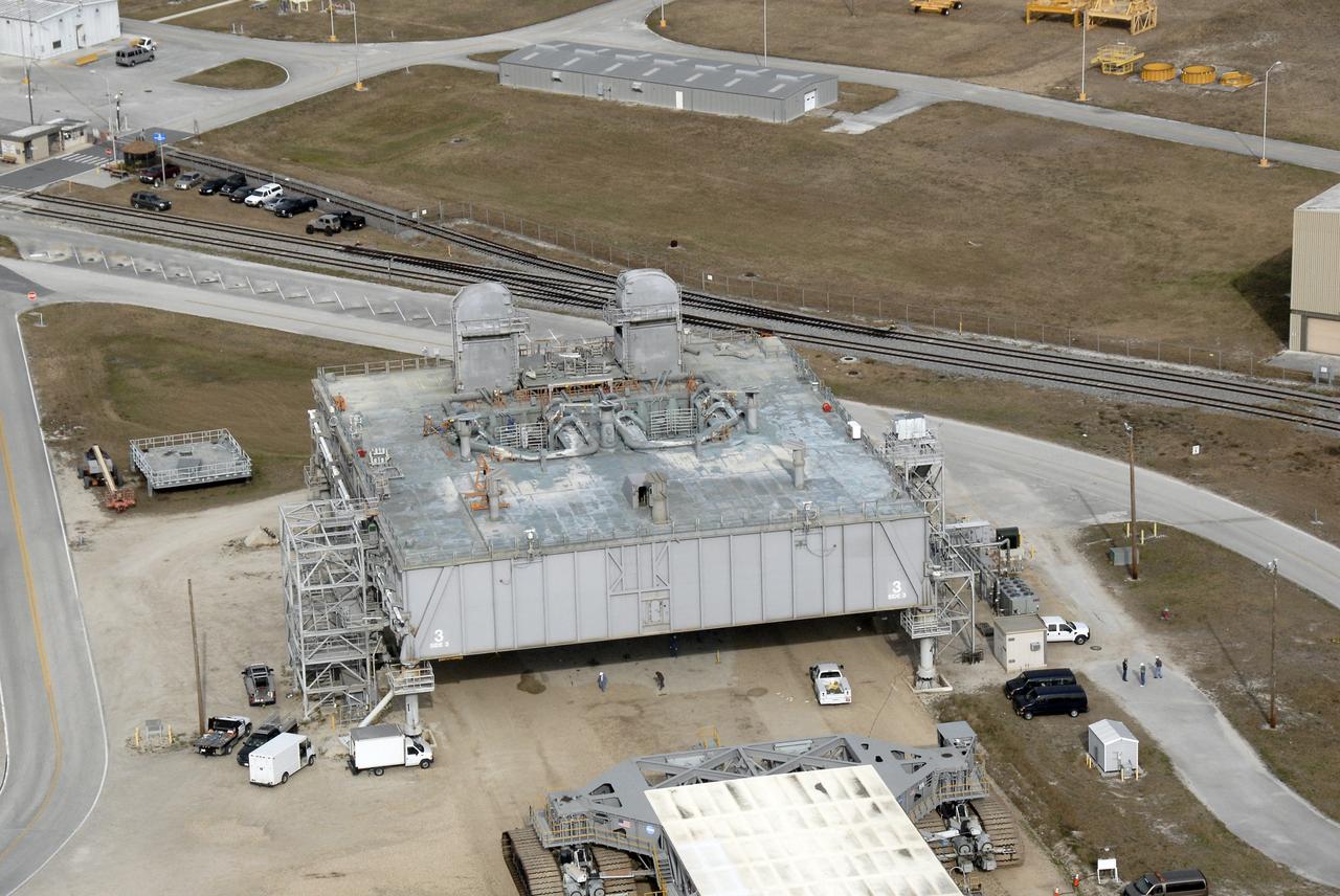 CAPE CANAVERAL, Fla. – An aerial view of a mobile launcher platform that is parked in the Launch Complex 39 Area at NASA's Kennedy Space Center in Florida. The platform, which is a moveable base for the launch of space shuttle, is a two-story steel structure 25 feet high, 160 feet long and 135 feet wide. It is constructed of welded steel up to 6 inches thick. The platform rests on six 22-foot-tall pedestals. Photo credit: NASA/Kim Shiflett