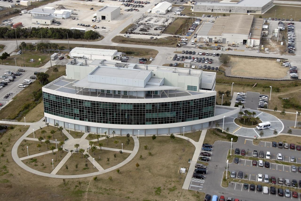 CAPE CANAVERAL, Fla. – An aerial view of the Operations Support Building II in the Launch Complex 39 Area at NASA's Kennedy Space Center in Florida. The panorama of windows faces the launch pads. Photo credit: NASA/Kim Shiflett