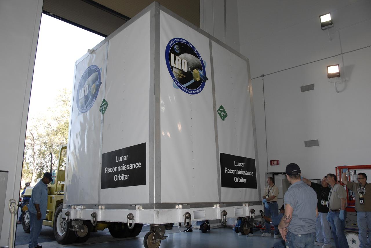 CAPE CANAVERAL, Fla. – NASA's Lunar Reconnaissance Orbiter, or LRO, spacecraft is moved into Astrotech in Titusville, Fla. The spacecraft was built by engineers at Goddard Space Flight Center, where it recently completed two months of tests in a thermal vacuum chamber.  The orbiter will carry seven instruments to provide scientists with detailed maps of the lunar surface and enhance our understanding of the moon's topography, lighting conditions, mineralogical composition and natural resources. Information gleaned from LRO will be used to select safe landing sites, determine locations for future lunar outposts and help mitigate radiation dangers to astronauts. The polar regions of the moon are the main focus of the mission because continuous access to sunlight may be possible and water ice may exist in permanently shadowed areas of the poles.  Accompanying LRO on its journey to the moon will be the Lunar Crater Observation and Sensing Satellite, or LCROSS, a mission that will impact the lunar surface in its search for water ice.  Launch of LRO is targeted for April 24.  Photo credit: NASA/Kim Shiflett