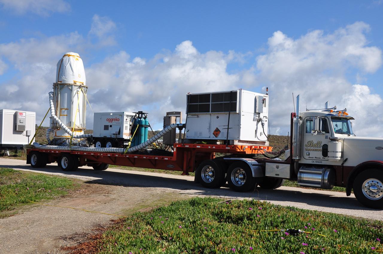 VANDENBERG AIR FORCE BASE, Calif. --  NASA's Orbiting Carbon Observatory, or OCO, is transported to Space Launch Complex 576-E at Vandenberg Air Force Base in California.  The spacecraft is scheduled for launch aboard Orbital Sciences' Taurus XL rocket on Feb. 23 from Vandenberg. The spacecraft will collect precise global measurements of carbon dioxide (CO2) in the Earth's atmosphere. Scientists will analyze OCO data to improve our understanding of the natural processes and human activities that regulate the abundance and distribution of this important greenhouse gas. This improved understanding will enable more reliable forecasts of future changes in the abundance and distribution of CO2 in the atmosphere and the effect that these changes may have on the Earth's climate.  Photo credit: NASA/Randy Beaudoin, VAFB