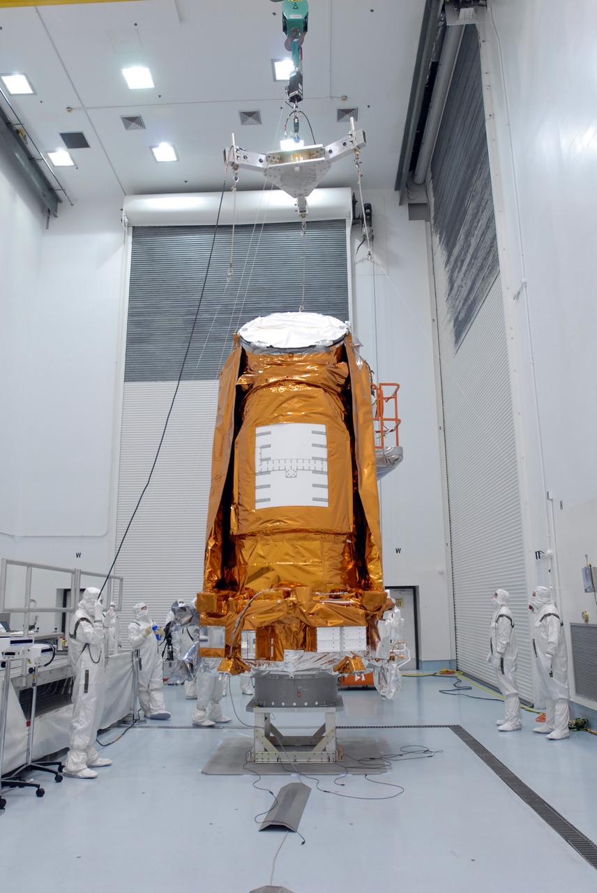 CAPE CANAVERAL, Fla. – At the Hazardous Processing Facility at Astrotech in Titusville, Fla., the crane-scale is moved into place above the Kepler spacecraft. The spacecraft will be lifted and weighed. Kepler is designed to survey more than 100,000 stars in our galaxy to determine the number of sun-like stars that have Earth-size and larger planets, including those that lie in a star's "habitable zone," a region where liquid water, and perhaps life, could exist. If these Earth-size worlds do exist around stars like our sun, Kepler is expected to be the first to find them and the first to measure how common they are. The liftoff of Kepler aboard a Delta II rocket is currently targeted for 10:48 p.m. EST March 5 from Space Launch Complex 17 on Cape Canaveral Air Force Station. Photo credit: NASA/Jim Grossmann