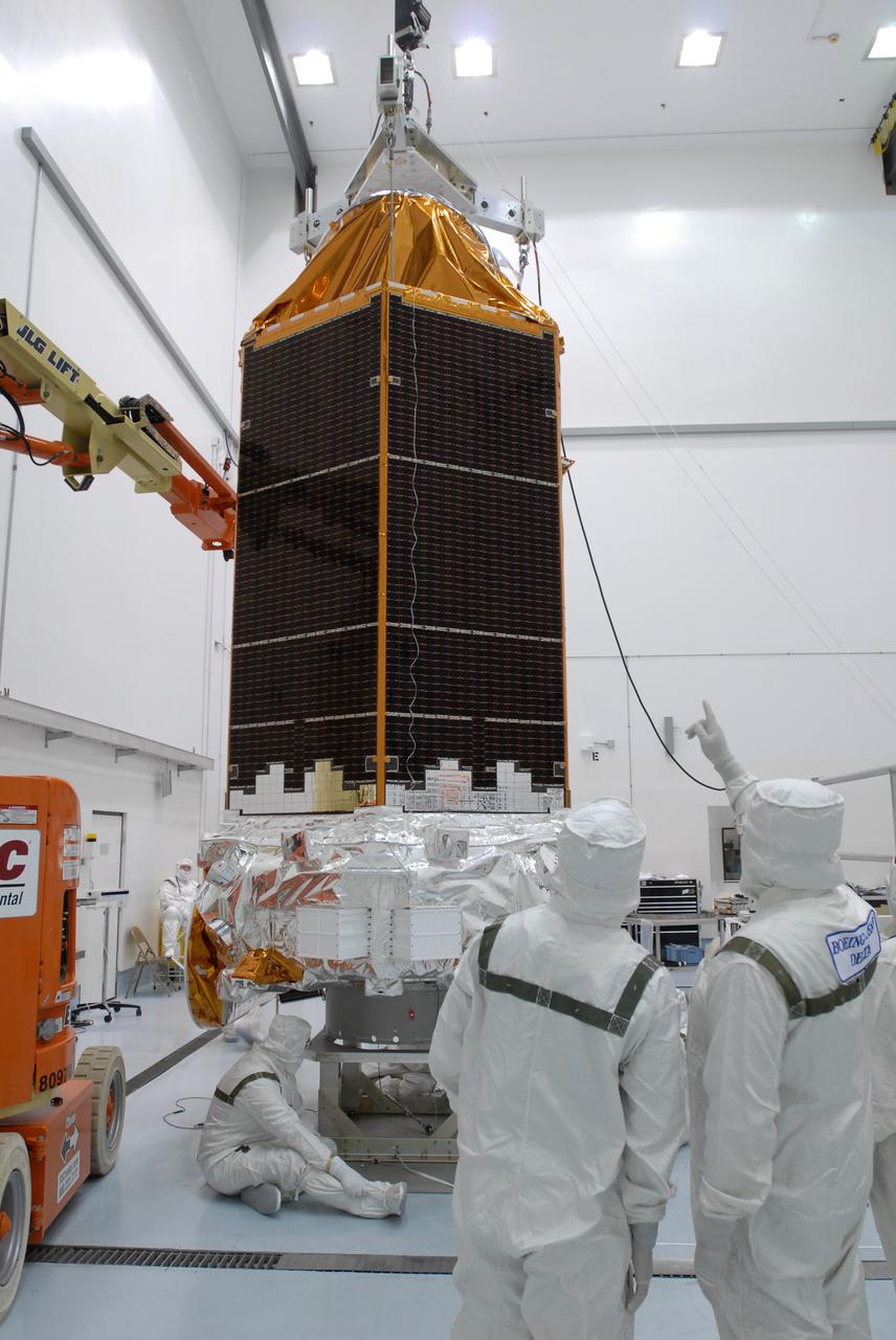 CAPE CANAVERAL, Fla. – At the Hazardous Processing Facility at Astrotech in Titusville, Fla., the Kepler spacecraft is lifted by the overhead crane. Special equipment on the crane will weigh the spacecraft. Kepler is designed to survey more than 100,000 stars in our galaxy to determine the number of sun-like stars that have Earth-size and larger planets, including those that lie in a star's "habitable zone," a region where liquid water, and perhaps life, could exist. If these Earth-size worlds do exist around stars like our sun, Kepler is expected to be the first to find them and the first to measure how common they are. The liftoff of Kepler aboard a Delta II rocket is currently targeted for 10:48 p.m. EST March 5 from Space Launch Complex 17 on Cape Canaveral Air Force Station. Photo credit: NASA/Jim Grossmann