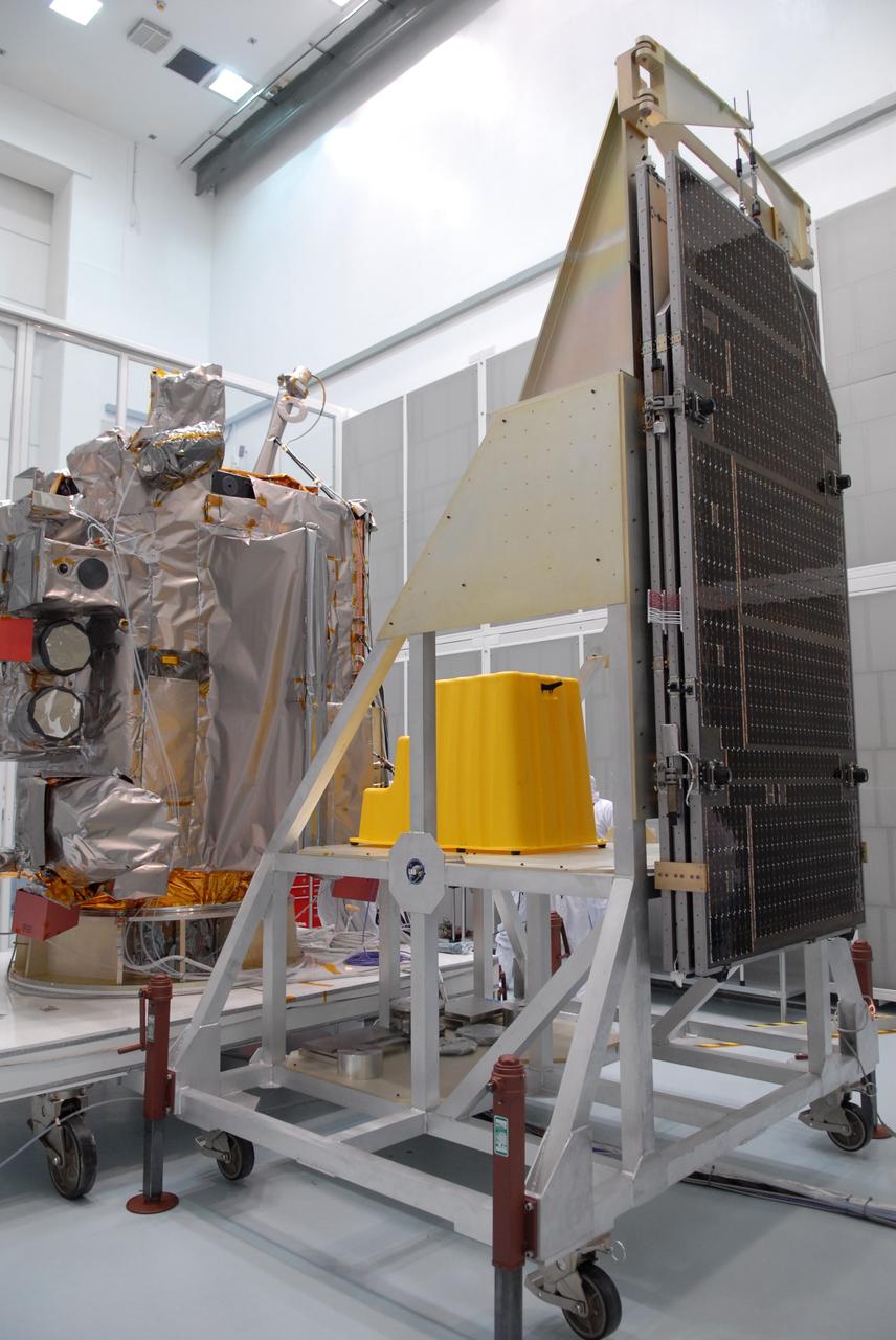 CAPE CANAVERAL, Fla. – Inspection begins of the solar arrays for NASA's Lunar Reconnaissance Orbiter, or LRO, at the Astrotech processing facility in Titusville, Fla.  The spacecraft was built by engineers at Goddard Space Flight Center, where it recently completed two months of tests in a thermal vacuum chamber. The orbiter will carry seven instruments to provide scientists with detailed maps of the lunar surface and enhance our understanding of the moon's topography, lighting conditions, mineralogical composition and natural resources. Information gleaned from LRO will be used to select safe landing sites, determine locations for future lunar outposts and help mitigate radiation dangers to astronauts. The polar regions of the moon are the main focus of the mission because continuous access to sunlight may be possible and water ice may exist in permanently shadowed areas of the poles. Accompanying LRO on its journey to the moon will be the Lunar Crater Observation and Sensing Satellite, or LCROSS, a mission that will impact the lunar surface in its search for water ice. Launch of LRO/LCROSS is targeted for April 24.     Photo credit: NASA/Jack Pfaller
