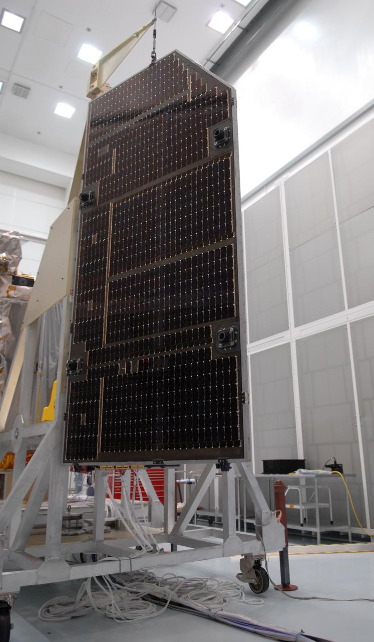 CAPE CANAVERAL, Fla. – Inspection is under way of the solar arrays for NASA's Lunar Reconnaissance Orbiter, or LRO, at the Astrotech processing facility in Titusville, Fla.  The spacecraft was built by engineers at Goddard Space Flight Center, where it recently completed two months of tests in a thermal vacuum chamber. The orbiter will carry seven instruments to provide scientists with detailed maps of the lunar surface and enhance our understanding of the moon's topography, lighting conditions, mineralogical composition and natural resources. Information gleaned from LRO will be used to select safe landing sites, determine locations for future lunar outposts and help mitigate radiation dangers to astronauts. The polar regions of the moon are the main focus of the mission because continuous access to sunlight may be possible and water ice may exist in permanently shadowed areas of the poles. Accompanying LRO on its journey to the moon will be the Lunar Crater Observation and Sensing Satellite, or LCROSS, a mission that will impact the lunar surface in its search for water ice. Launch of LRO/LCROSS is targeted for April 24.     Photo credit: NASA/Jack Pfaller
