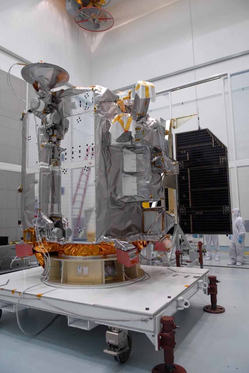 CAPE CANAVERAL, Fla. – The solar arrays for NASA's Lunar Reconnaissance Orbiter, or LRO, are inspected at the Astrotech processing facility in Titusville, Fla.   The spacecraft was built by engineers at Goddard Space Flight Center, where it recently completed two months of tests in a thermal vacuum chamber. The orbiter will carry seven instruments to provide scientists with detailed maps of the lunar surface and enhance our understanding of the moon's topography, lighting conditions, mineralogical composition and natural resources. Information gleaned from LRO will be used to select safe landing sites, determine locations for future lunar outposts and help mitigate radiation dangers to astronauts. The polar regions of the moon are the main focus of the mission because continuous access to sunlight may be possible and water ice may exist in permanently shadowed areas of the poles. Accompanying LRO on its journey to the moon will be the Lunar Crater Observation and Sensing Satellite, or LCROSS, a mission that will impact the lunar surface in its search for water ice. Launch of LRO/LCROSS is targeted for April 24.     Photo credit: NASA/Jack Pfaller
