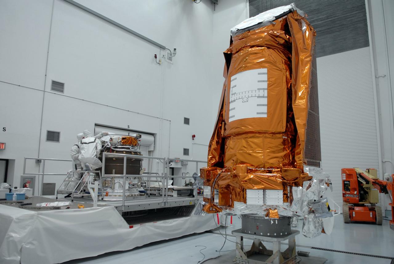 CAPE CANAVERAL, Fla. – At the Hazardous Processing Facility at Astrotech in Titusville, Fla., the Kepler spacecraft awaits the next step in its processing: mating to a Delta II third stage.  Kepler is designed to survey more than 100,000 stars in our galaxy to determine the number of sun-like stars that have Earth-size and larger planets, including those that lie in a star's "habitable zone," a region where liquid water, and perhaps life, could exist. If these Earth-size worlds do exist around stars like our sun, Kepler is expected to be the first to find them and the first to measure how common they are. The liftoff of Kepler aboard a Delta II rocket is currently targeted for 10:48 p.m. EST March 5 from Space Launch Complex 17 on Cape Canaveral Air Force Station. Photo credit: NASA/Troy Cryder