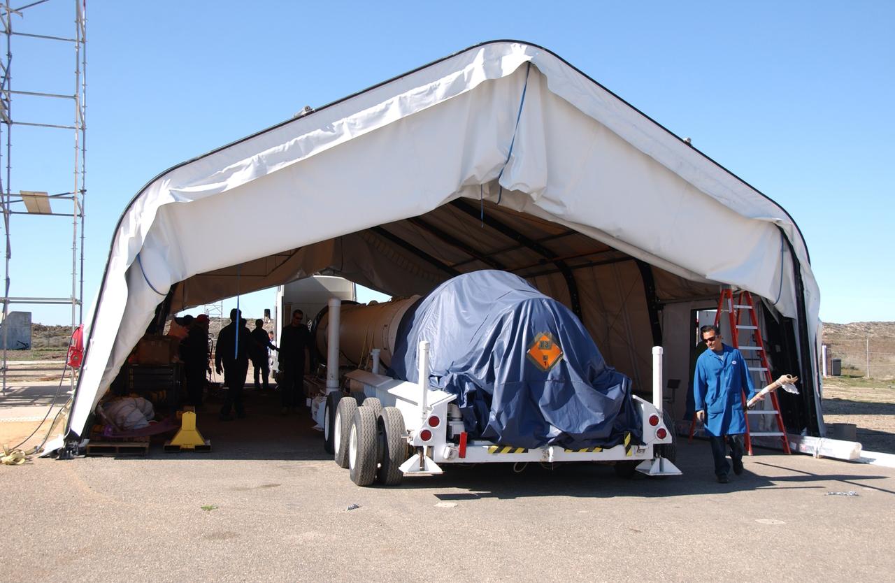 VANDENBERG AIR FORCE BASE, Calif. -- Stages 1, 2 and 3 of Orbital Sciences’ Taurus XL launch vehicle for NASA’s Orbiting Carbon Observatory, or OCO, are parked under a tent at Space Launch Complex 576-E at Vandenberg Air Force Base in California. The OCO is an Earth-orbiting mission sponsored by NASA's Earth System Science Pathfinder Program. The observatory will collect precise global measurements of carbon dioxide in the Earth's atmosphere. Scientists will analyze the data returned to better understand the natural processes and human activities that regulate the abundance and distribution of this important greenhouse gas.  Launch is targeted for 1:51:30 a.m. PST Feb. 24. Photo credit: VAFB