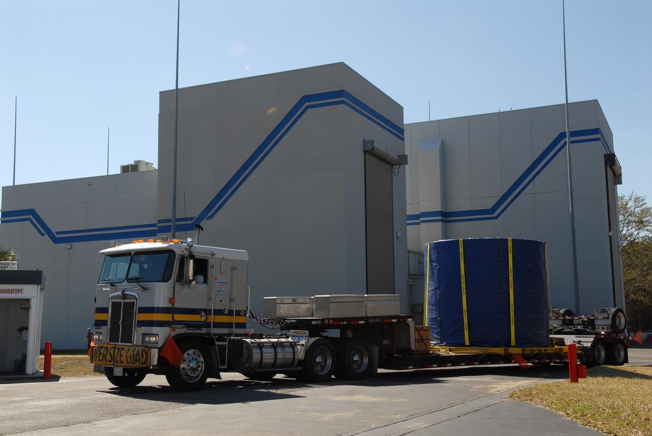 CAPE CANAVERAL, Fla. – The Ares I-X fifth segment simulator aft section is being transported from the Astrotech facility in Titusville, Fla., to NASA's Kennedy Space Center in Florida.   Ares I-X is the test vehicle for the Ares I, which is part of the Constellation Program to return men to the moon and beyond. Ares I is the essential core of a safe, reliable, cost-effective space transportation system that eventually will carry crewed missions back to the moon, on to Mars and out into the solar system. Ares I-X is targeted for launch in July 2009. Photo credit: NASA/Troy Cryder