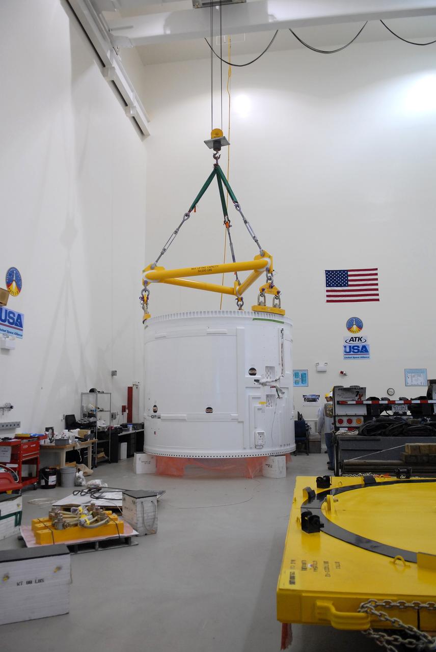 CAPE CANAVERAL, Fla. – The Ares I-X fifth segment simulator aft section is lowered onto a stand in the Vehicle Assembly Building's extended duration orbiter lab, or EDO, at NASA's Kennedy Space Center in Florida.  Ares I-X is the test vehicle for the Ares I, which is part of the Constellation Program to return men to the moon and beyond. Ares I is the essential core of a safe, reliable, cost-effective space transportation system that eventually will carry crewed missions back to the moon, on to Mars and out into the solar system. Ares I-X is targeted for launch in July 2009. Photo credit: NASA/Troy Cryder
