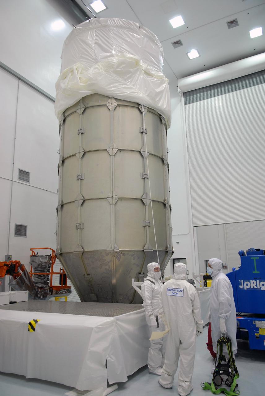 CAPE CANAVERAL, Fla. – At the Astrotech payload processing facility in Titusville, Fla., the top of the canister has been attached to the lower segments encasing NASA's Kepler spacecraft. The canister surrounding Kepler provides protection during the spacecraft's transport to the pad. The liftoff of Kepler aboard a Delta II rocket is currently targeted for 10:48 p.m. EST March 5 from Pad 17-B. Kepler is designed to survey more than 100,000 stars in our galaxy to determine the number of sun-like stars that have Earth-size and larger planets, including those that lie in a star's "habitable zone," a region where liquid water, and perhaps life, could exist. If these Earth-size worlds do exist around stars like our sun, Kepler is expected to be the first to find them and the first to measure how common they are. Photo credit: NASA/Troy Cryder