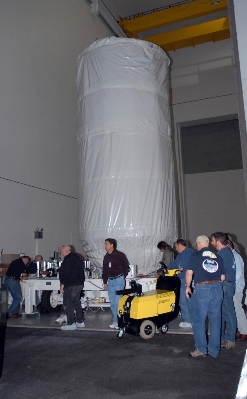 CAPE CANAVERAL, Fla. – NASA's Kepler spacecraft, enclosed in a canister and protective cover, is ready to leave the Astrotech payload processing facility in Titusville, Fla. Kepler is being moved to Launch Pad 17-B at Cape Canaveral Air Force Station. The liftoff of Kepler aboard a Delta II rocket is currently targeted for 10:48 p.m. EST March 5 from Pad 17-B. Kepler is designed to survey more than 100,000 stars in our galaxy to determine the number of sun-like stars that have Earth-size and larger planets, including those that lie in a star's "habitable zone," a region where liquid water, and perhaps life, could exist. If these Earth-size worlds do exist around stars like our sun, Kepler is expected to be the first to find them and the first to measure how common they are. Photo credit: NASA/Jack Pfaller