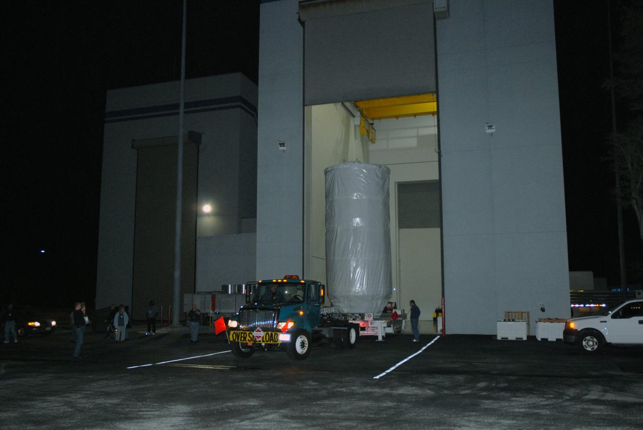 CAPE CANAVERAL, Fla. – NASA's Kepler spacecraft, enclosed in a canister and protective cover, leaves the Astrotech payload processing facility in Titusville, Fla. Kepler is being moved to Launch Pad 17-B at Cape Canaveral Air Force Station.The liftoff of Kepler aboard a Delta II rocket is currently targeted for 10:48 p.m. EST March 5 from Pad 17-B. Kepler is designed to survey more than 100,000 stars in our galaxy to determine the number of sun-like stars that have Earth-size and larger planets, including those that lie in a star's "habitable zone," a region where liquid water, and perhaps life, could exist. If these Earth-size worlds do exist around stars like our sun, Kepler is expected to be the first to find them and the first to measure how common they are. Photo credit: NASA/Jack Pfaller