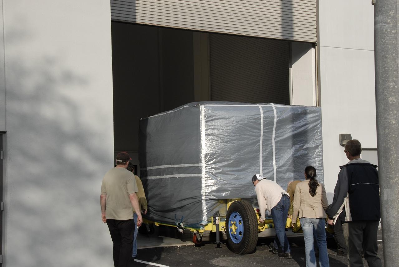 CAPE CANAVERAL, Fla. – At Astrotech in Titusville, Fla., NASA's Lunar CRater Observation and Sensing Satellite, known as LCROSS, is moved into the facility where it will be uncrated. LCROSS arrived from Northrop Grumman's facility in Redondo Beach, Calif. The satellite's primary mission is to search for water ice on the moon in a permanently shadowed crater near one of the lunar poles. LCROSS is a low-cost, accelerated-development, companion mission to NASA's Lunar Reconnaissance Orbiter, or LRO. At Kennedy, the two spacecraft will be integrated with an Atlas V launch vehicle and tested for final flight worthiness. LCROSS and LRO are the first missions in NASA's plan to return humans to the moon and begin establishing a lunar outpost by 2020. Photo credit: NASA/Kim Shiflett