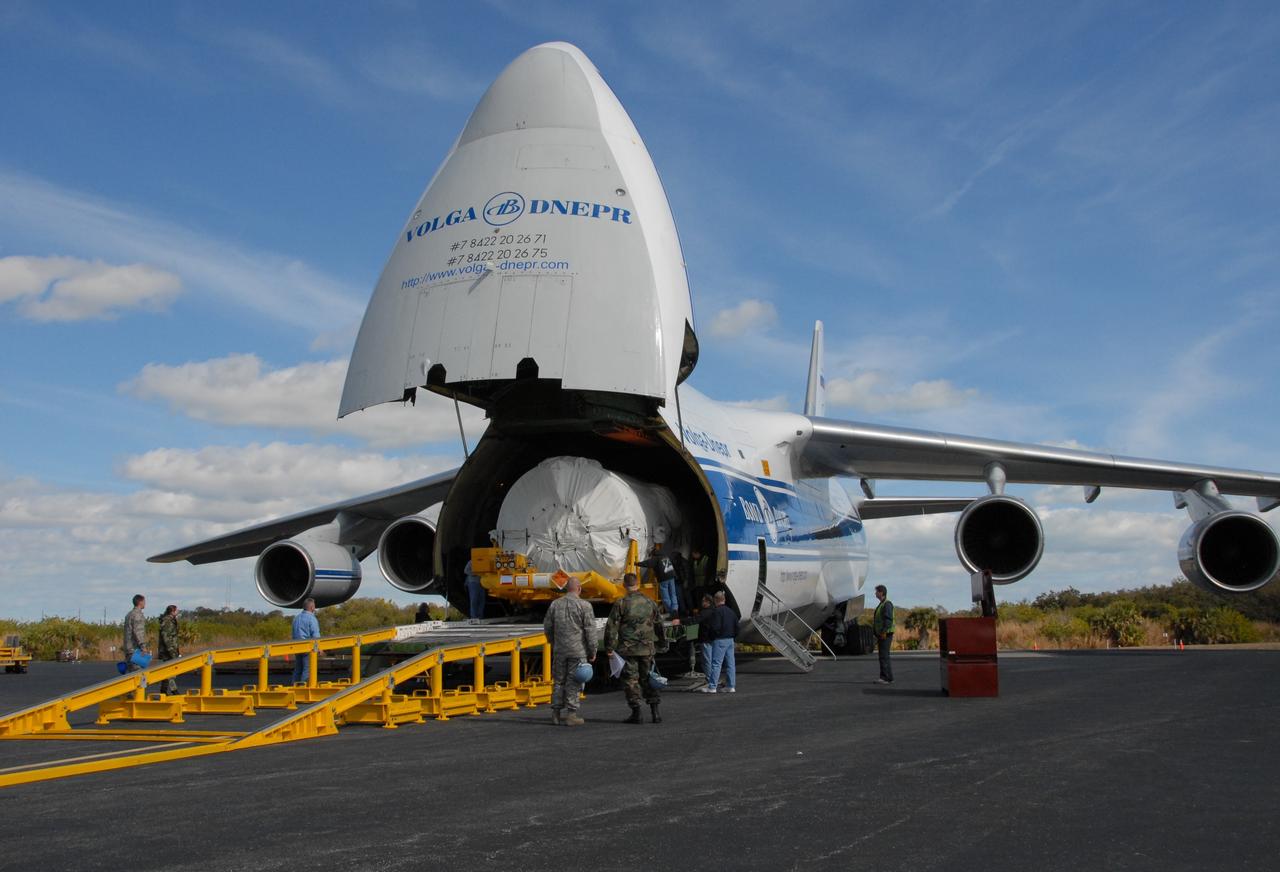 CAPE CANAVERAL, Fla. – With the nose raised on the Russian AH-124-100 aircraft on Cape Canaveral Air Force Station's skid strip in Florida, the Centaur stage of the Atlas V rocket inside is moved out of the cargo area. The Atlas V will launch NASA's Lunar Reconnaissance Orbiter, or LRO, and NASA's Lunar CRater Observation and Sensing Satellite, known as LCROSS. The two spacecraft will be integrated with the Atlas V and tested for final flight worthiness. Launch is scheduled for the spring. LCROSS and LRO are the first missions in NASA's plan to return humans to the moon and begin establishing a lunar outpost by 2020. Photo credit: NASA/Cory Huston