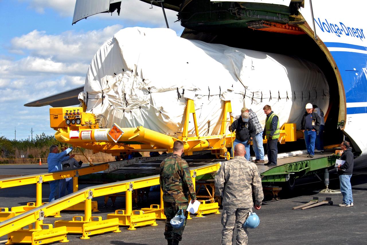 CAPE CANAVERAL, Fla. – On Cape Canaveral Air Force Station's skid strip in Florida, workers help with the offloading of the Centaur stage of the Atlas V rocket from the Russian AH-124-100 aircraft. The Atlas V will launch NASA's Lunar Reconnaissance Orbiter, or LRO, and NASA's Lunar CRater Observation and Sensing Satellite, known as LCROSS. The two spacecraft will be integrated with the Atlas V and tested for final flight worthiness. Launch is scheduled for the spring. LCROSS and LRO are the first missions in NASA's plan to return humans to the moon and begin establishing a lunar outpost by 2020. Photo credit: NASA/Cory Huston