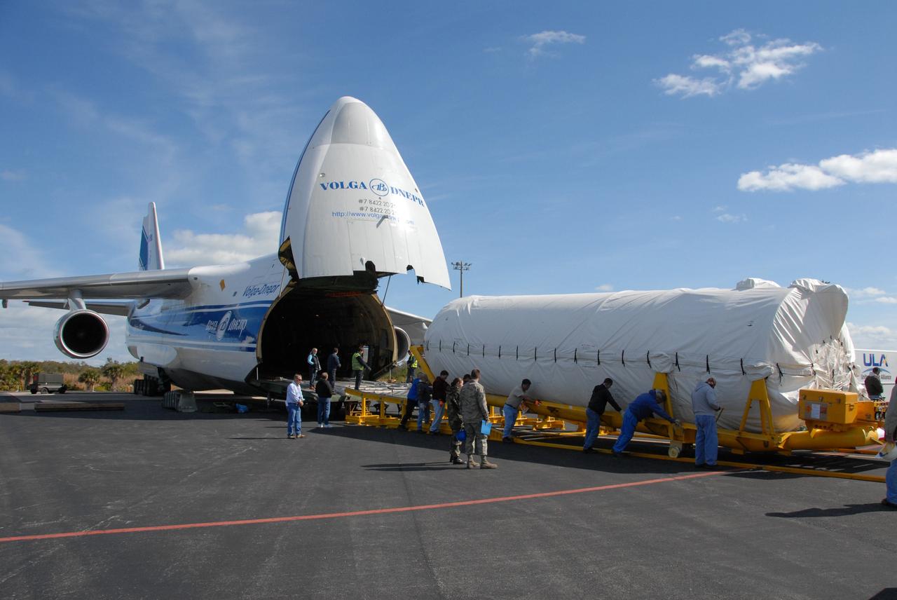 CAPE CANAVERAL, Fla. – On Cape Canaveral Air Force Station's skid strip in Florida, workers help with the offloading of the Centaur stage of the Atlas V rocket from the Russian AH-124-100 aircraft. The Atlas V will launch NASA's Lunar Reconnaissance Orbiter, or LRO, and NASA's Lunar CRater Observation and Sensing Satellite, known as LCROSS. The two spacecraft will be integrated with the Atlas V and tested for final flight worthiness. Launch is scheduled for the spring. LCROSS and LRO are the first missions in NASA's plan to return humans to the moon and begin establishing a lunar outpost by 2020. Photo credit: NASA/Cory Huston